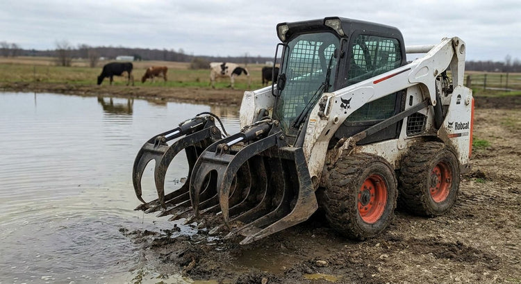 Skid steer attachments for dairy effluent pond maintenance