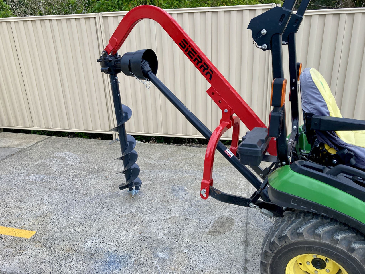 Small tractor top post hole digger