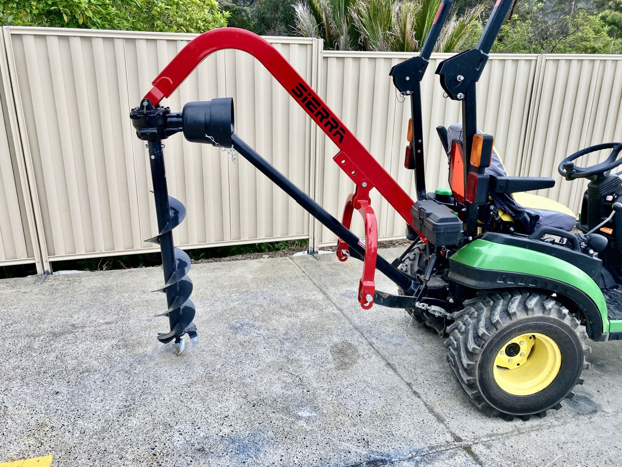 Post hole digger top for mini tractor